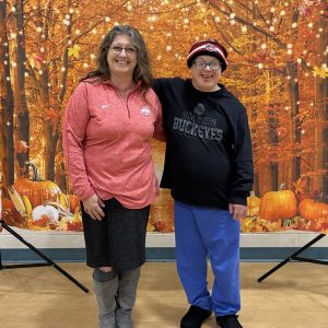 Two individuals smiling