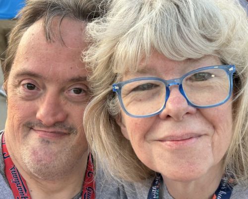 Two individuals smiling